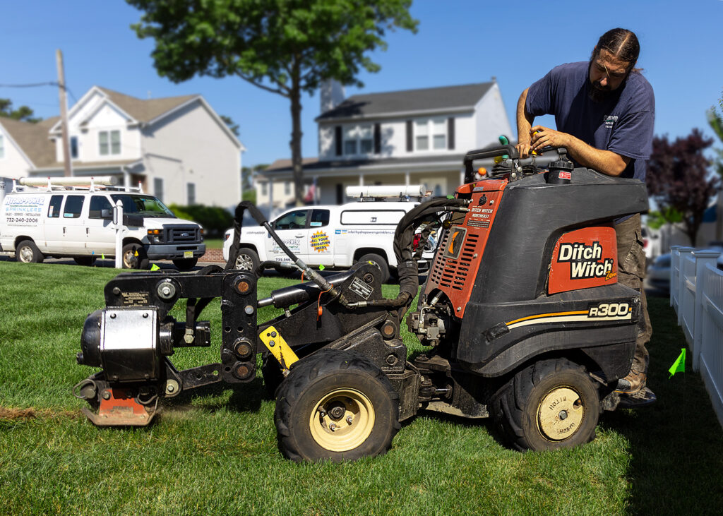 Using a Ditch Witch to pull irrigation piping